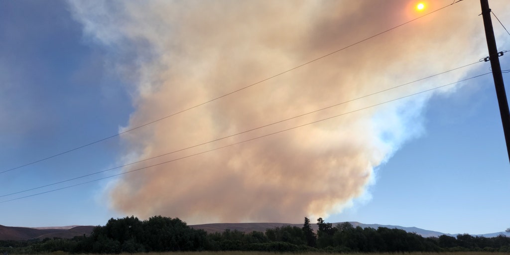 As the Cow Canyon Fire erupts in Central Washington, evacuations are requested; it is only partially contained.